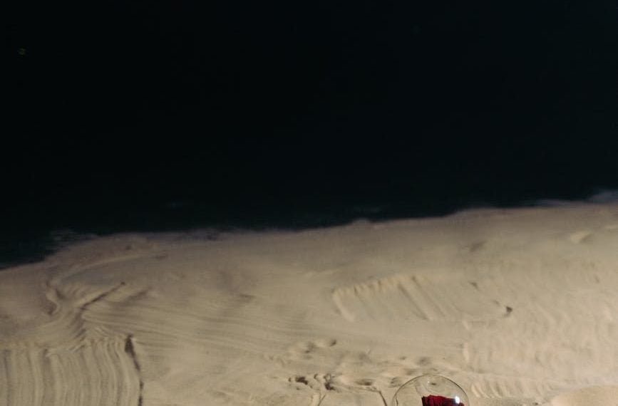red rose on the sand